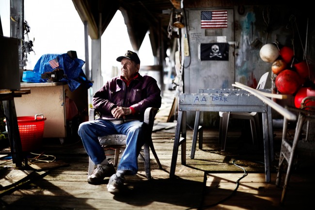 Austin Dorr, I wanted to photograph this man the very first day I saw him, years later I did in a personal project about the marina where I was living in at that time in Gloucester, Massachusetts. He wrote his name on everything he owned on the dock. On the door to his workshop right in between the American Flag and the Jolly Rodger, he wrote in sharpie, “If a man is too busy to go fishing, he is too damn busy.”